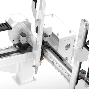 Przemysłowy robot kartezjański z prowadnicami i napędami stosowany do automatyzacji procesów produkcyjnych.